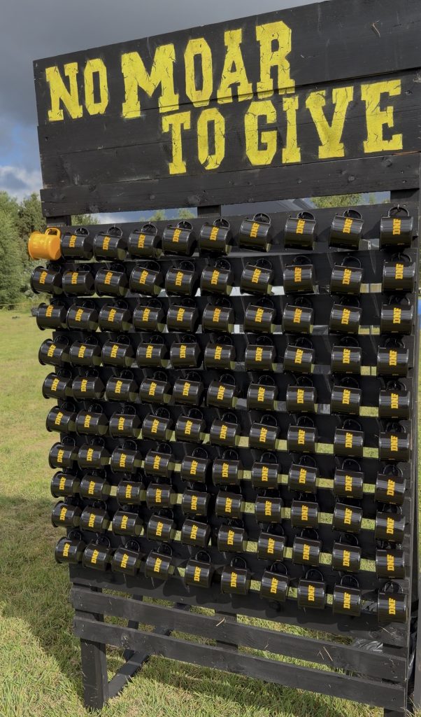MOAR events Mug wall with DNF cups hung for competitors